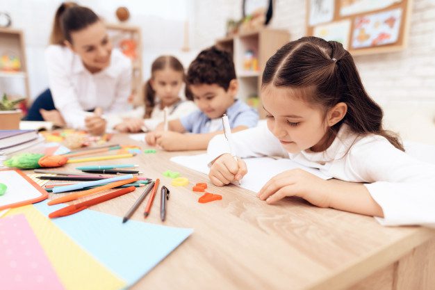 children-write-notebooks-with-pen_94347-731